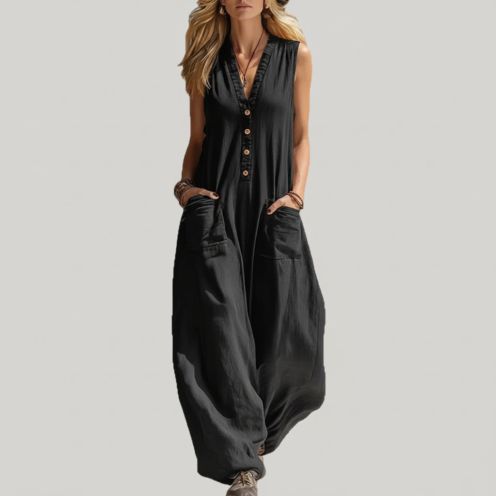 Black sleeveless jumpsuit worn by a model against a neutral background