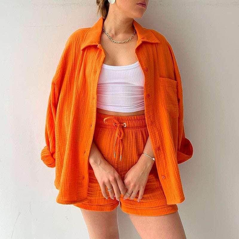 Woman wearing trendy orange shirt and shorts set with white crop top, ZA-Zola fashion UK