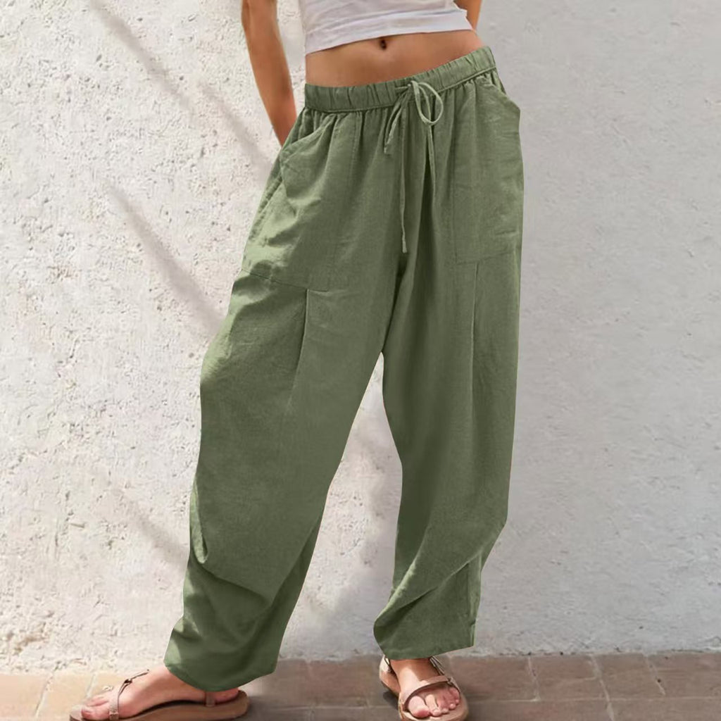 Green wide-leg pants worn by a person against a light background