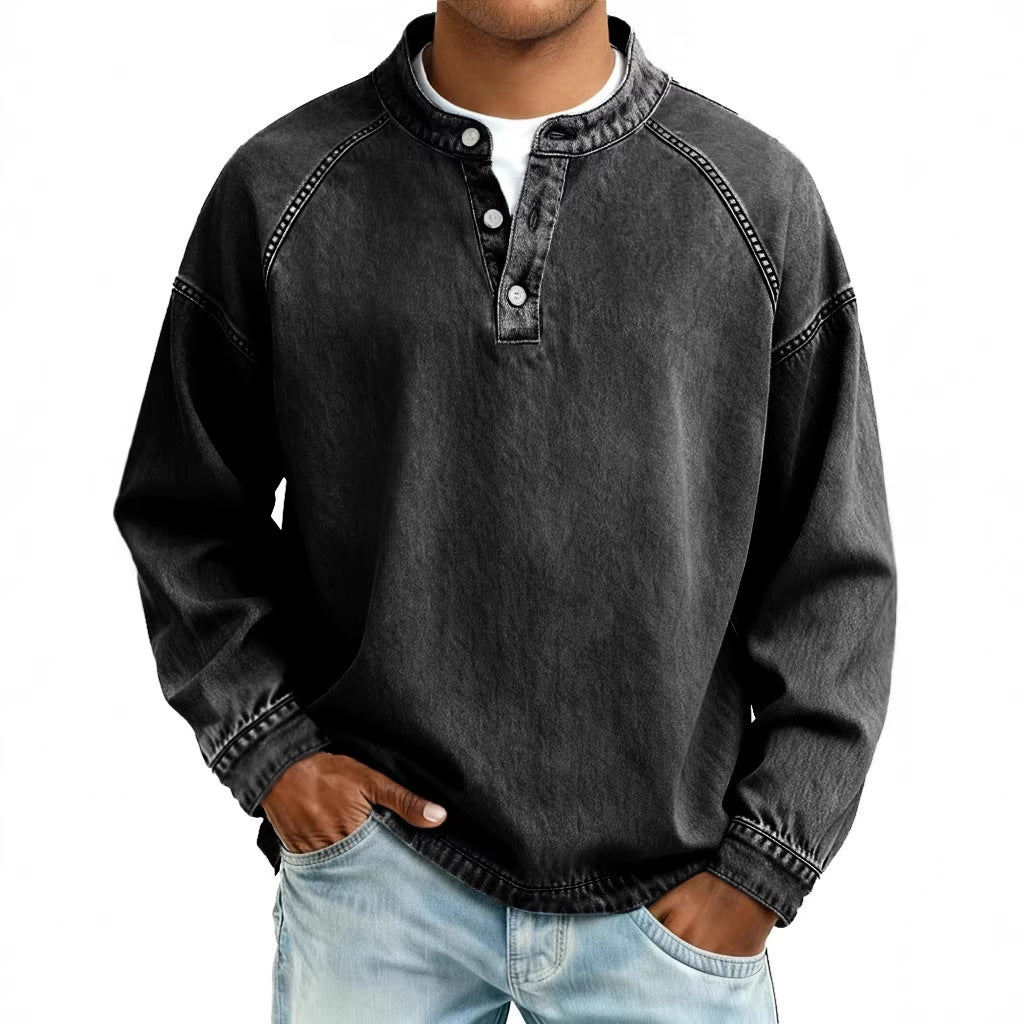 Person wearing a black long-sleeve shirt with button details on a white background