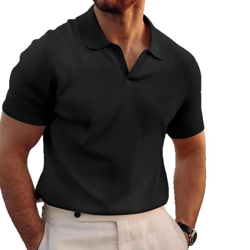 Man wearing a black polo shirt on a white background