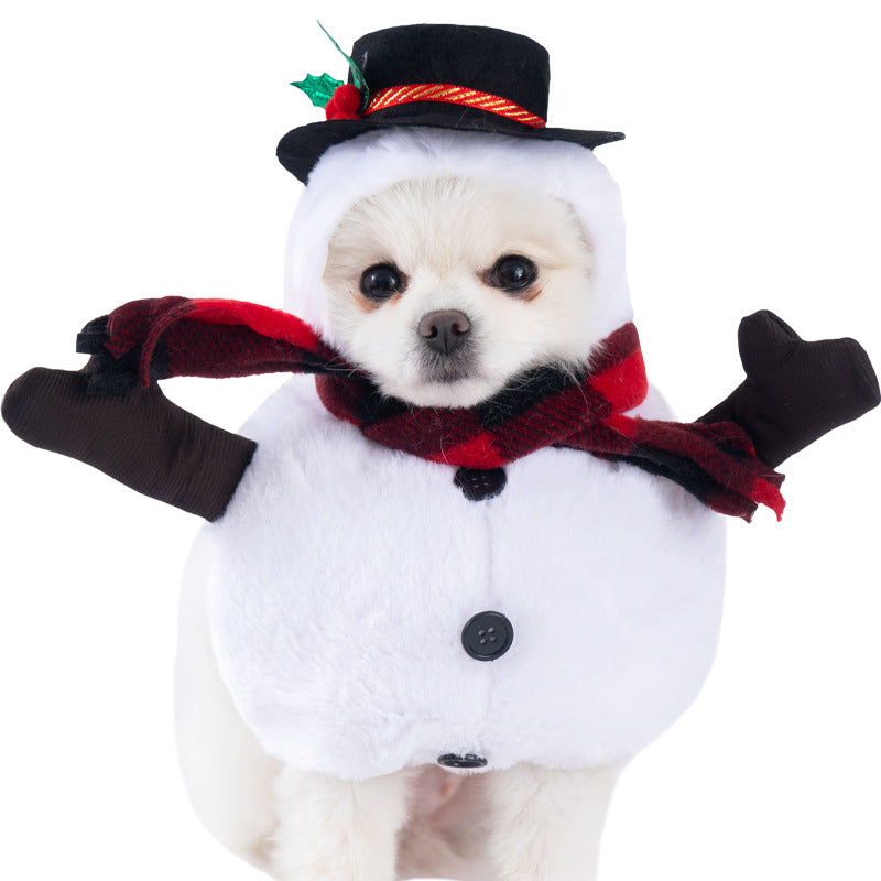 Dog wearing a snowman costume with a black top hat, red scarf, and black gloves on a white background.