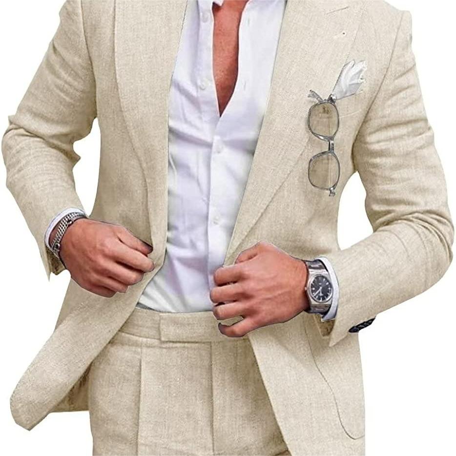 Man wearing a beige suit with a white shirt and glasses on a white background