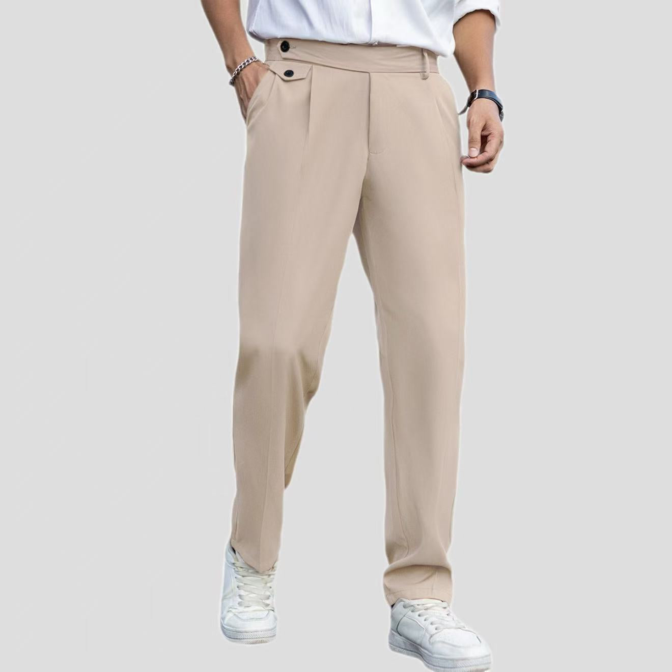 Beige pants worn by a person on a plain background