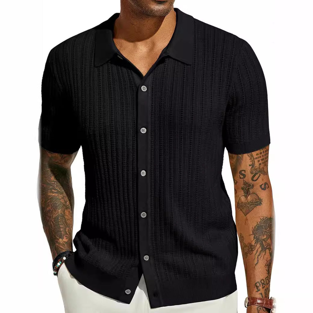 Man wearing a black short-sleeve button-up shirt on a white background