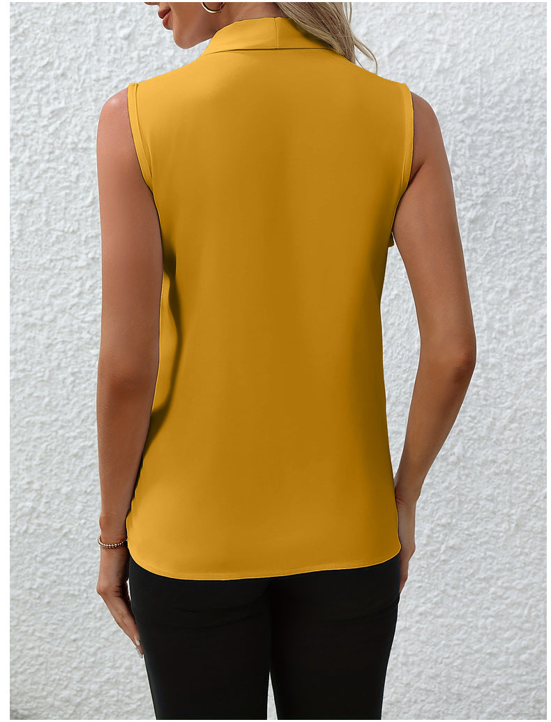 Yellow sleeveless top worn by a person against a light gray background