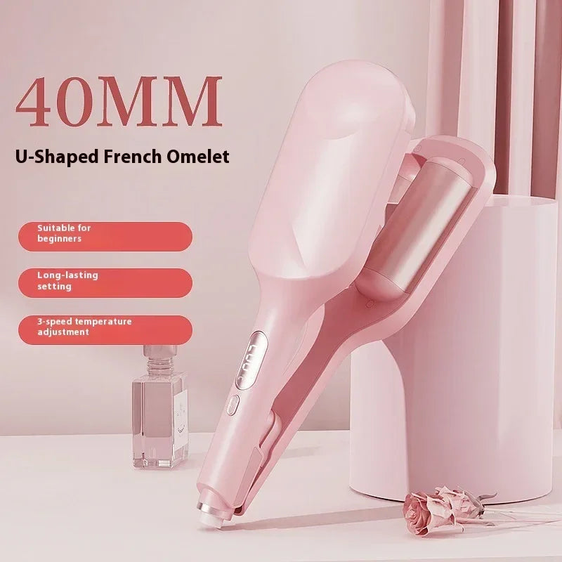 Pink 40mm U-shaped hair curler with adjustable temperature, styled on a vanity table.