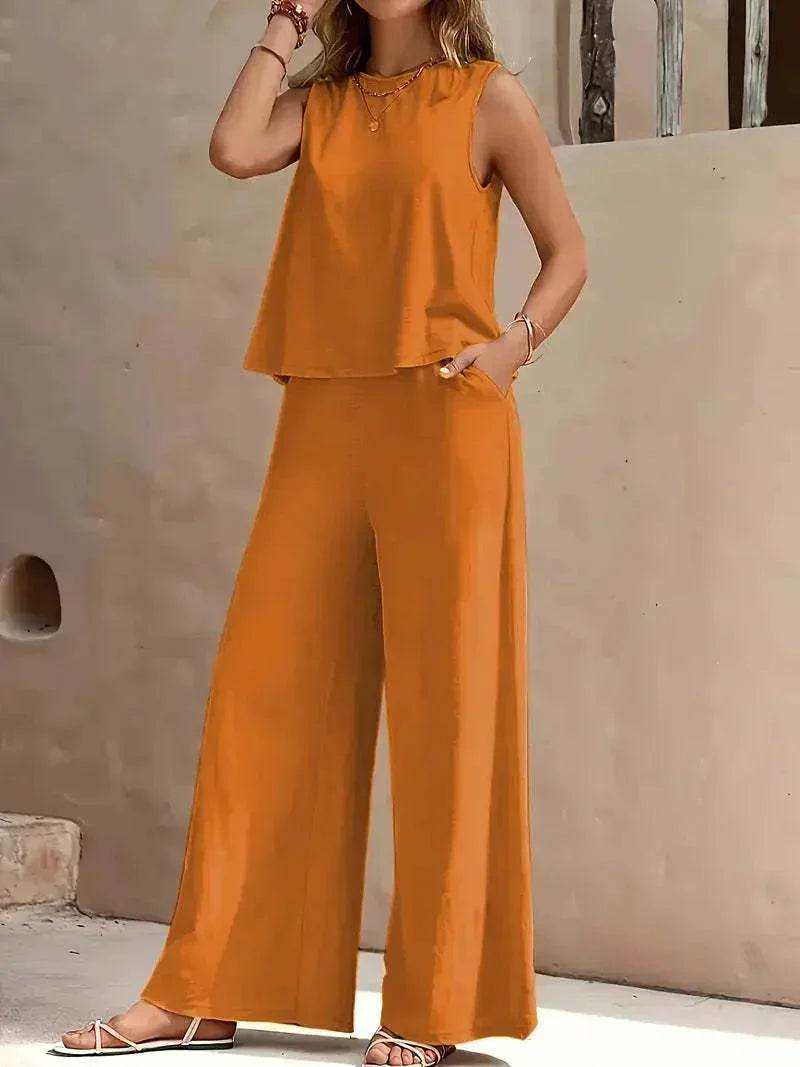 Woman in sleeveless orange wide-leg jumpsuit, trendy summer fashion from ZA-Zola UK