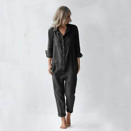 Woman in loose black button-up jumpsuit, minimalist fashion, ZA-Zola United Kingdom style