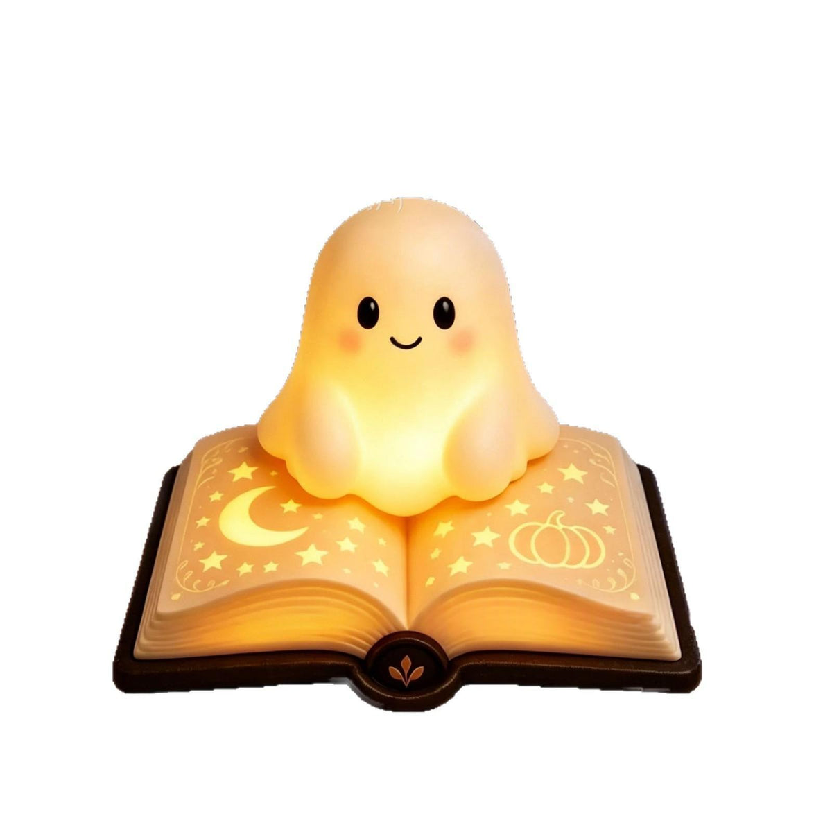 A cute glowing ghost night light sitting on top of an open book lamp. The ghost has a smiling face and rosy cheeks, casting a warm yellow light.
