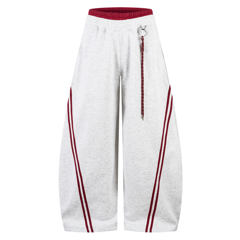 White wide-leg pants with red accents on a white background