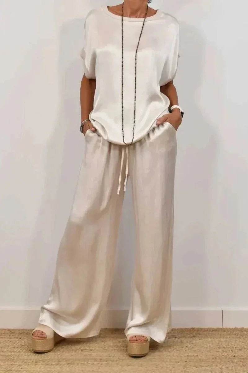 Woman wearing loose cream blouse and wide-leg pants with platform sandals, ZA-Zola fashion