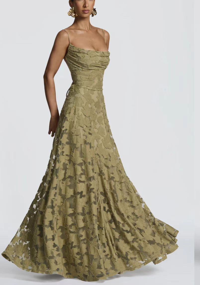 Woman wearing a green floral gown on a white background