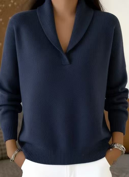 Navy blue sweater worn by a person with a neutral background