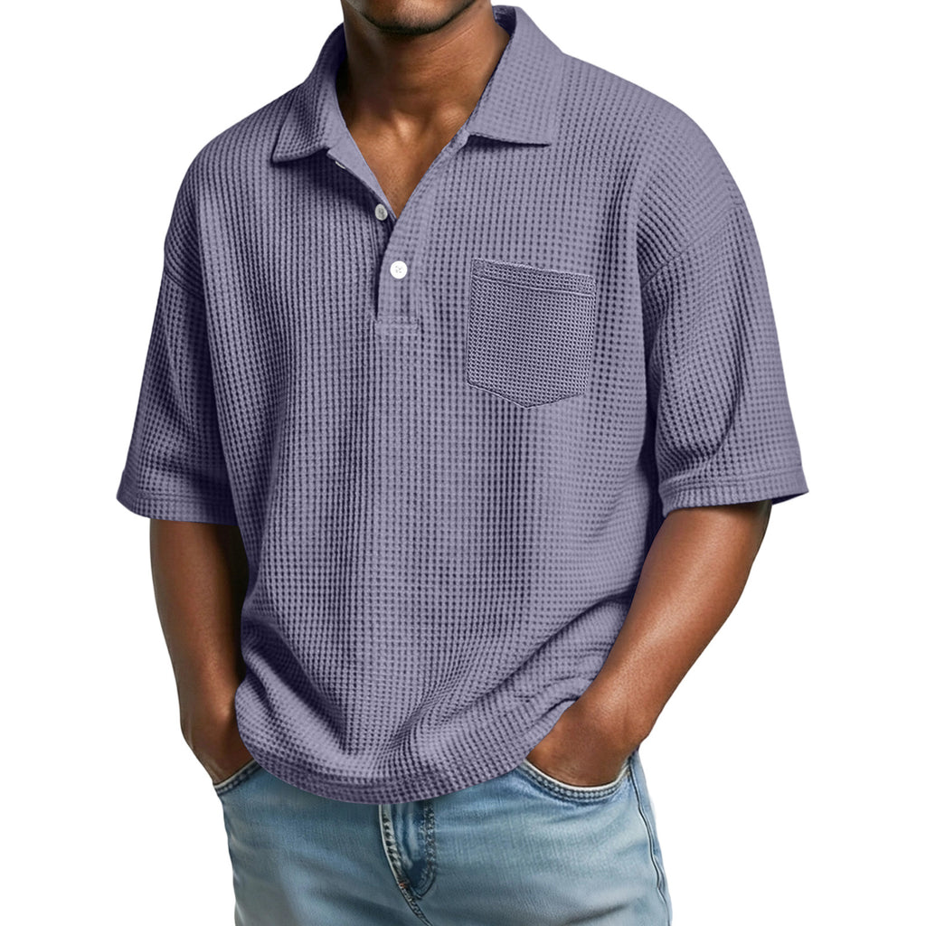 Man wearing a checkered purple shirt with a pocket on a white background