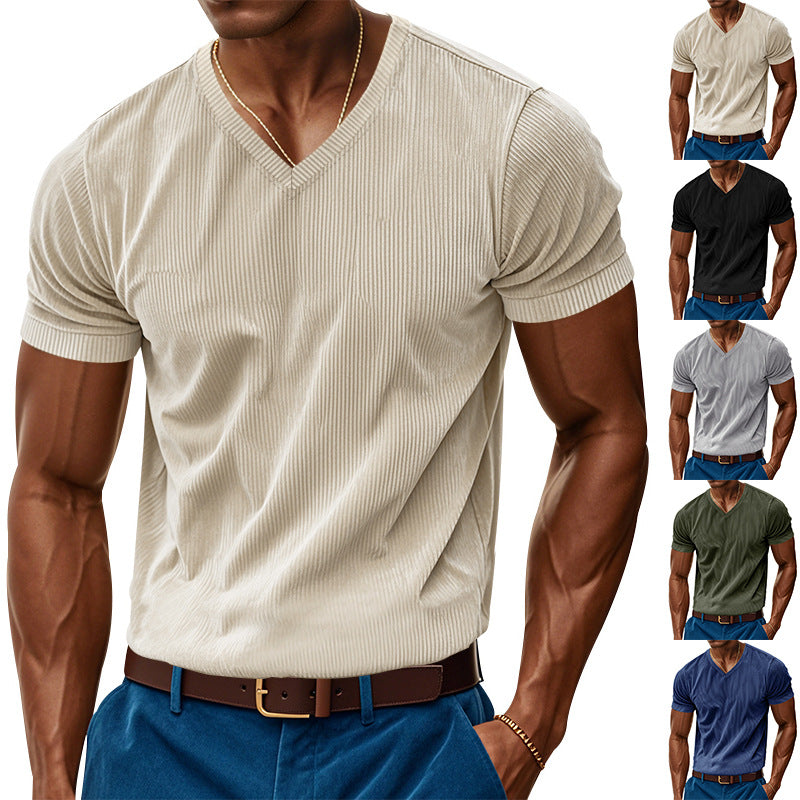 Man wearing a beige ribbed V-neck t-shirt with multiple color options displayed.
