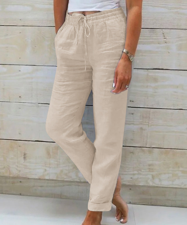 Beige pants worn by a person against a wooden background