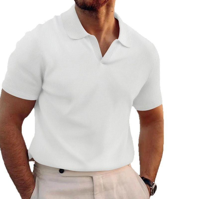 White polo shirt worn by a person on a white background