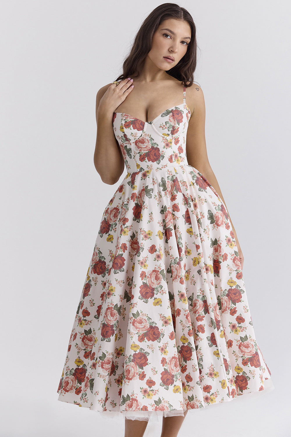 Woman wearing a floral dress on a white background