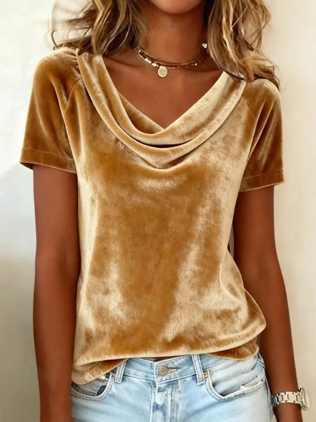 Brown velvet top worn by a person with a neutral background