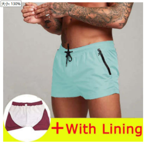 Light blue swim shorts with a zipper pocket on a gray background, with inset showing lining.