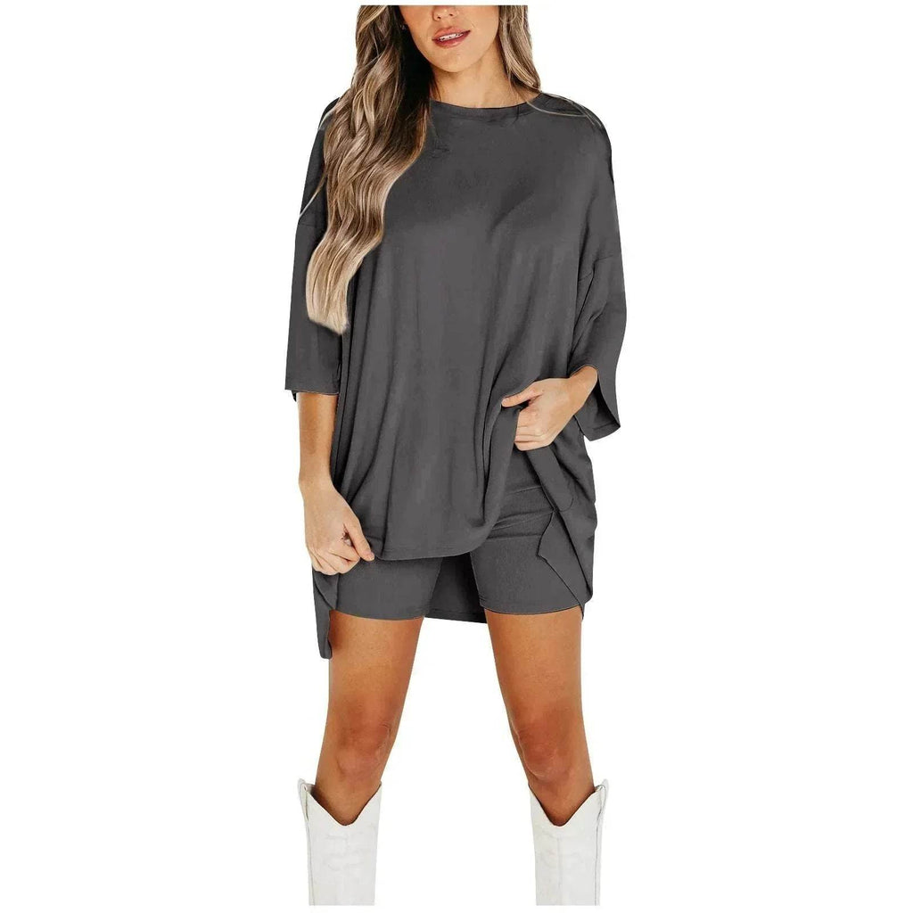 Woman wearing trendy dark gray oversized shirt and shorts set with white boots, ZA-Zola fashion