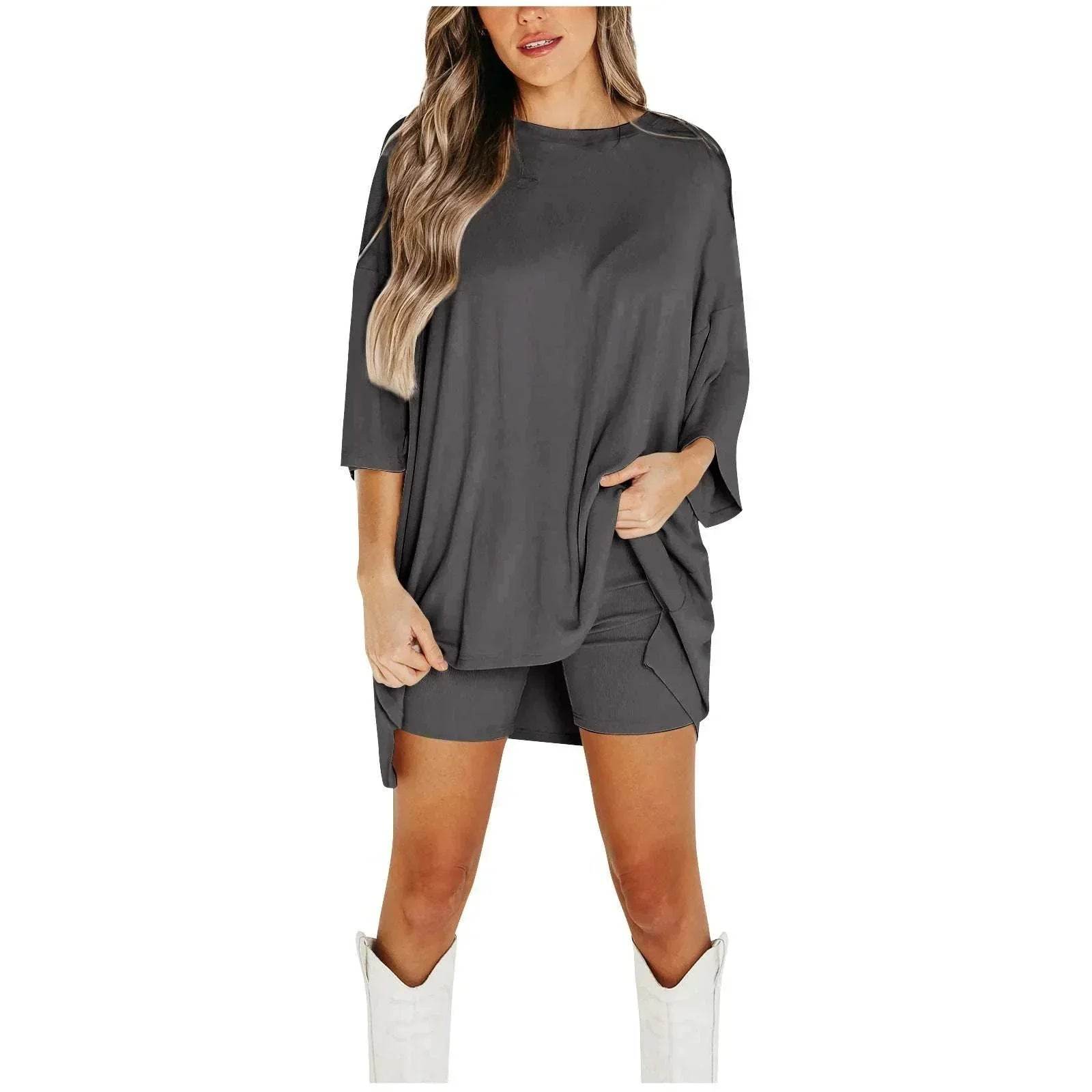 Woman wearing trendy dark gray oversized shirt and shorts set with white boots, ZA-Zola fashion