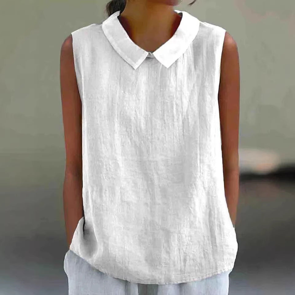 White sleeveless shirt with a collar worn by a person against a neutral background