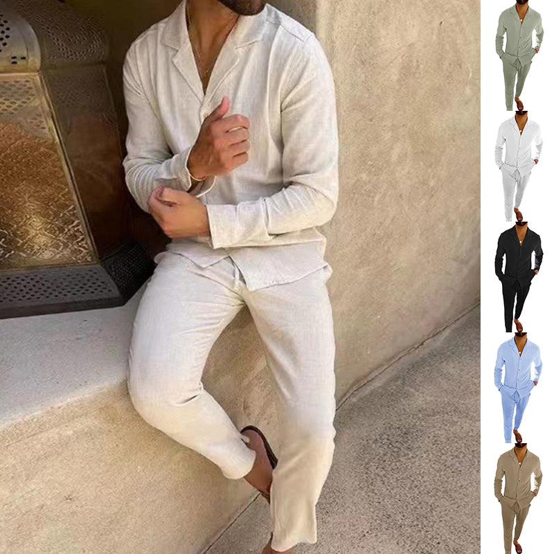 Person wearing a white outfit sitting on a step with a textured wall background.