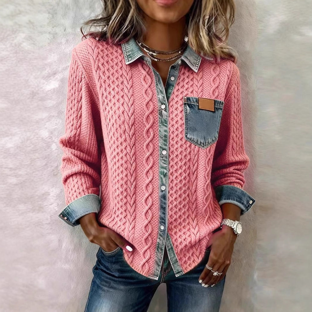 Person wearing a pink cable knit shirt with denim accents on a light background