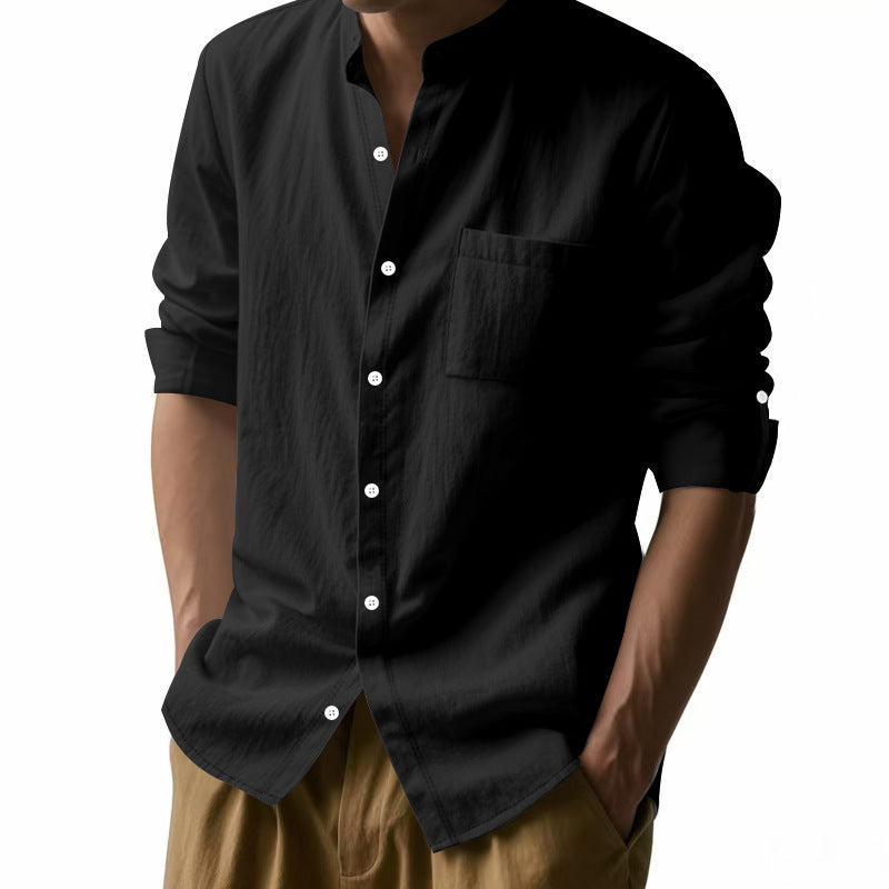 Black button-up shirt worn by a person on a white background