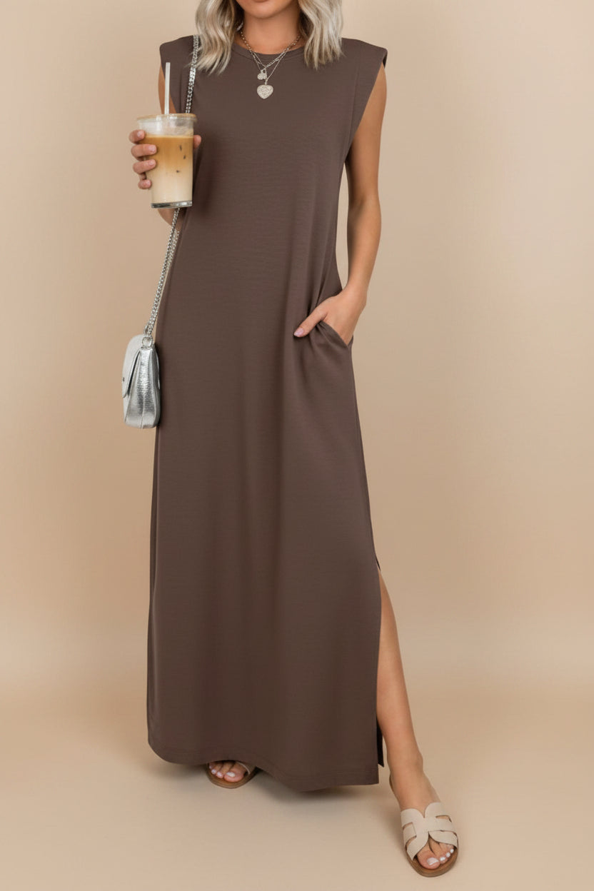 Woman wearing a brown sleeveless dress on a white background