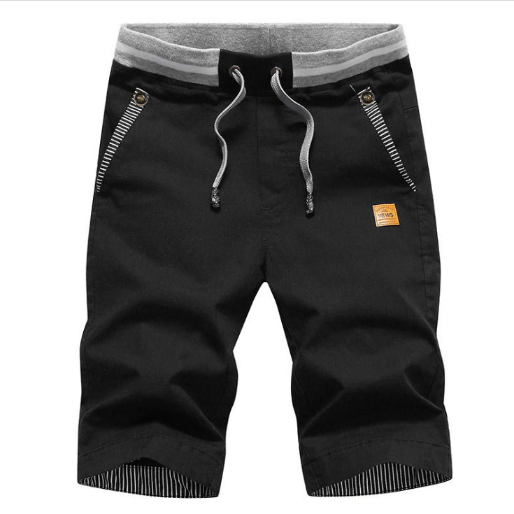 Navy blue shorts with a gray waistband on a white background