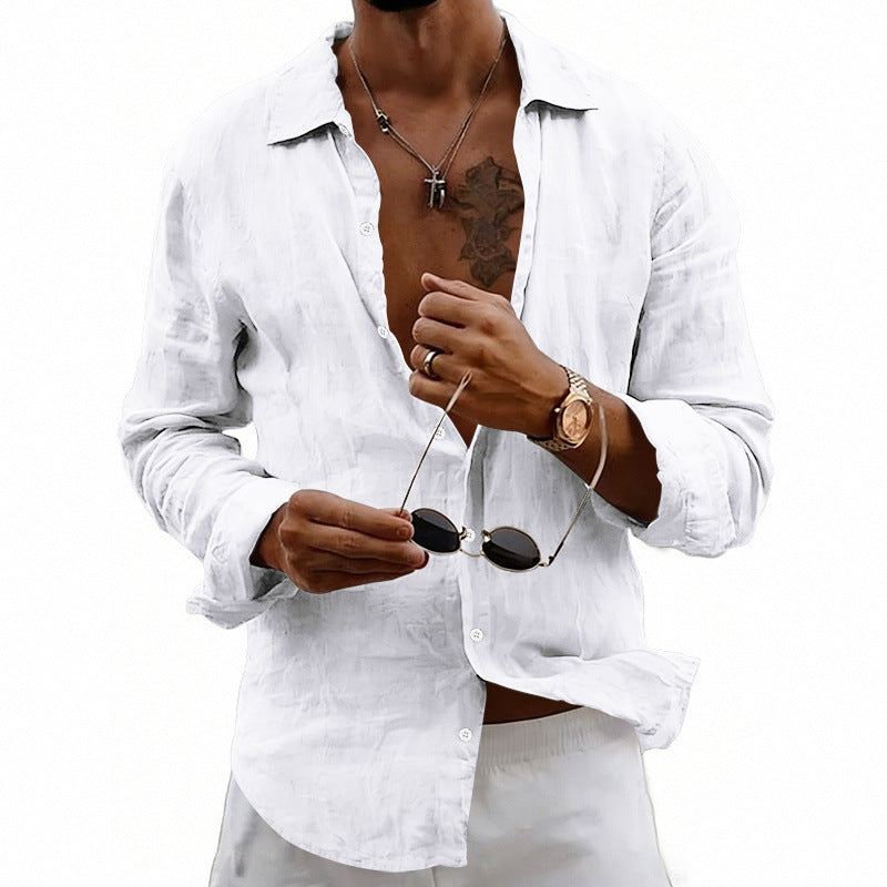 Person wearing a white shirt with rolled-up sleeves, holding sunglasses, on a white background