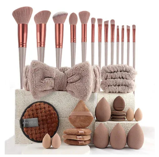Makeup brush set with beauty sponges, headbands, and cleansing pads on display.