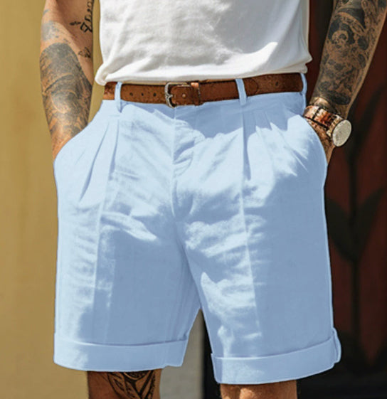 Light blue shorts worn by a person with tattoos on arms and legs, against a neutral background.