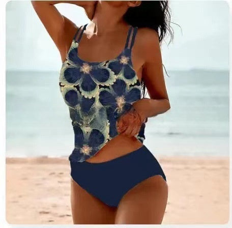 Woman wearing a floral blue swimsuit on a beach