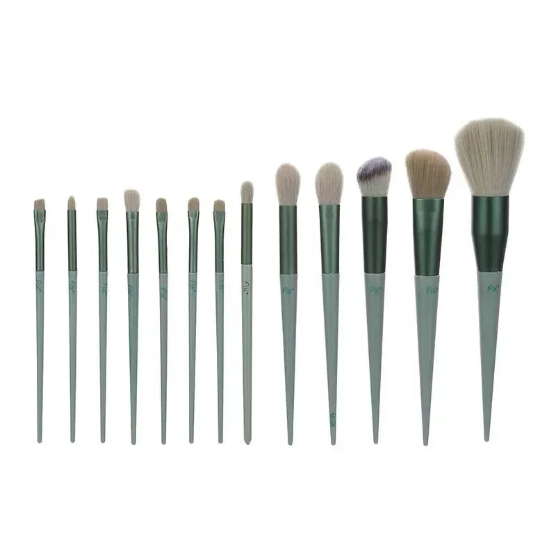 Set of 13 green makeup brushes with soft bristles for face and eye cosmetic application