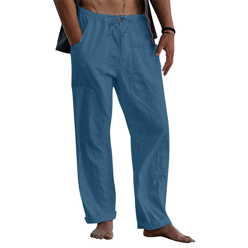 Blue pants worn by a person on a white background
