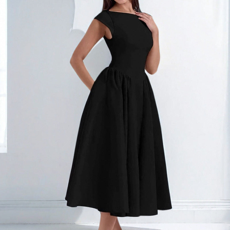 Black dress worn by a person on a white background
