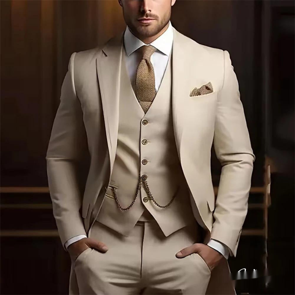 Man wearing a beige suit with a patterned tie against a dark background