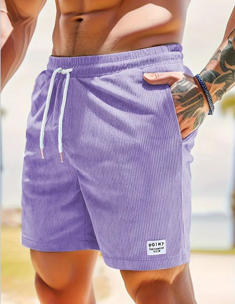 Person wearing purple shorts with a blurred background