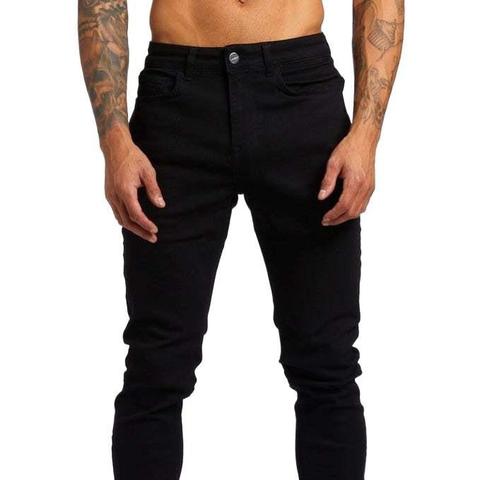 Person wearing black jeans on a white background