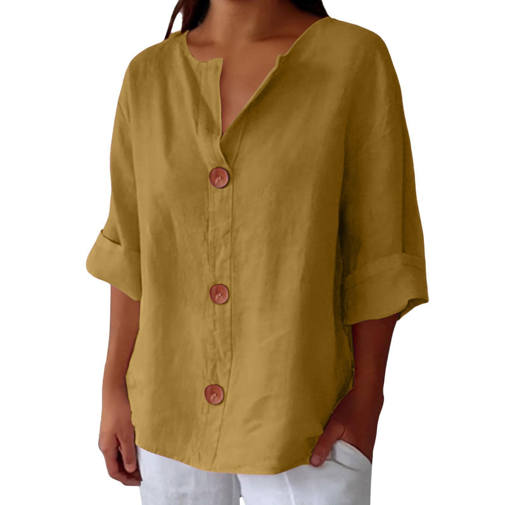 Yellow button-up shirt worn by a person on a white background