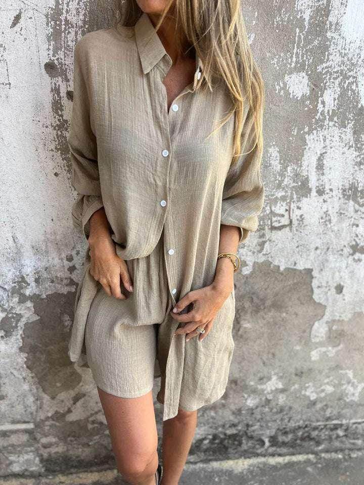 Woman wearing beige button-up shirt and shorts set, ZA-Zola trendy fashion, textured wall background
