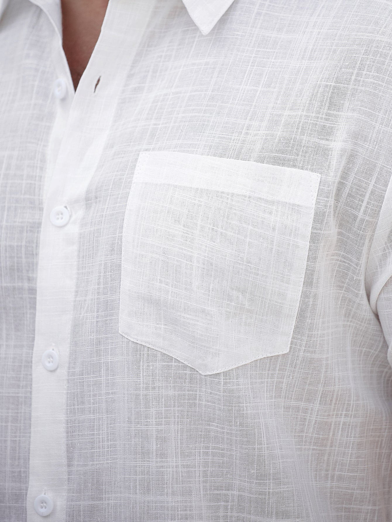 Close-up of a white shirt with a pocket