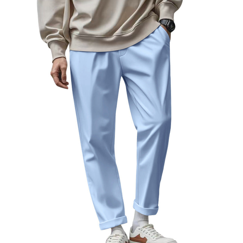 Light blue pants worn by a person on a white background