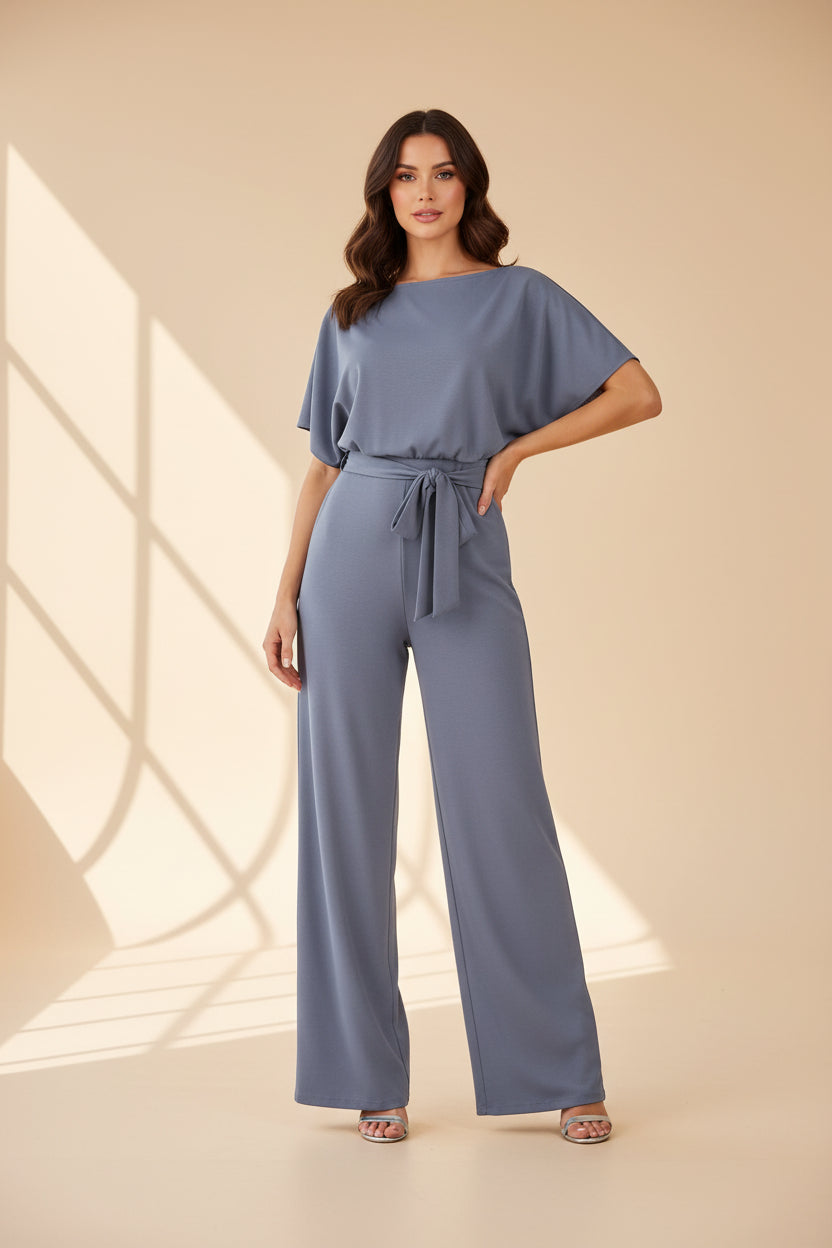 Gray jumpsuit worn by a model on a white background