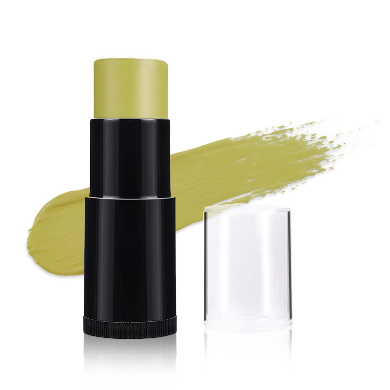 Makeup stick with green shade on a white background