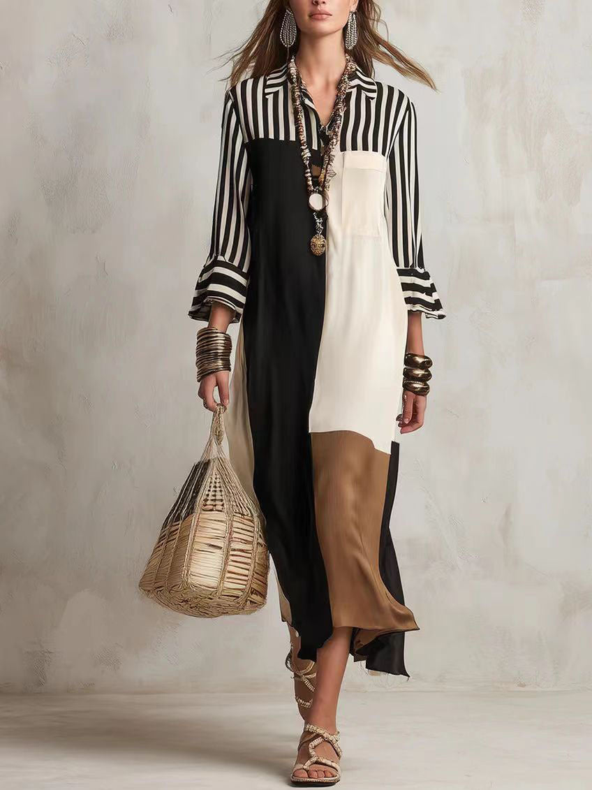 Woman wearing a black and white striped shirt with a long dress holding a woven bag against a neutral background